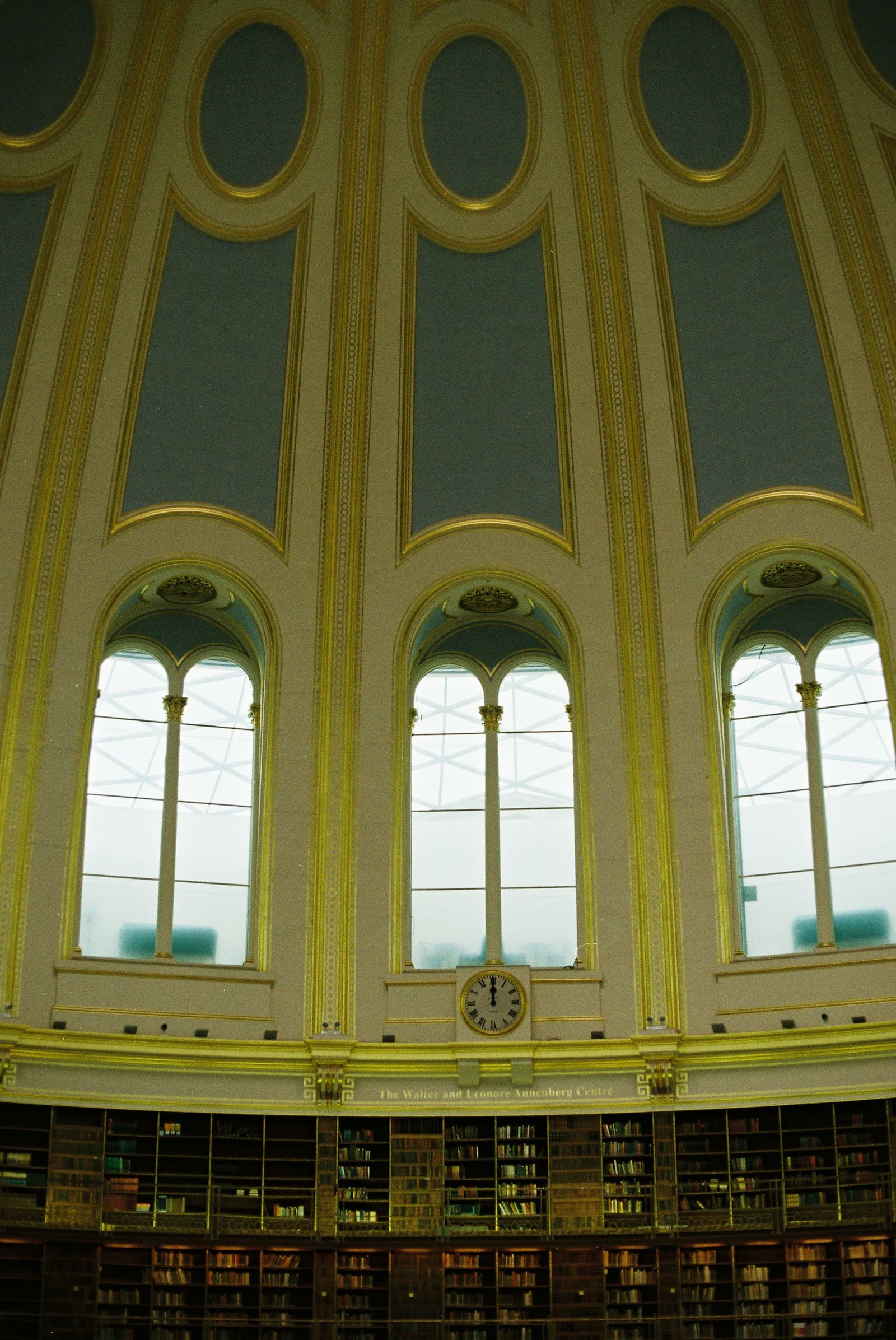 Grand library reading room with arched windows and classical bookshelves, evoking legal scholarship and institutional trust.